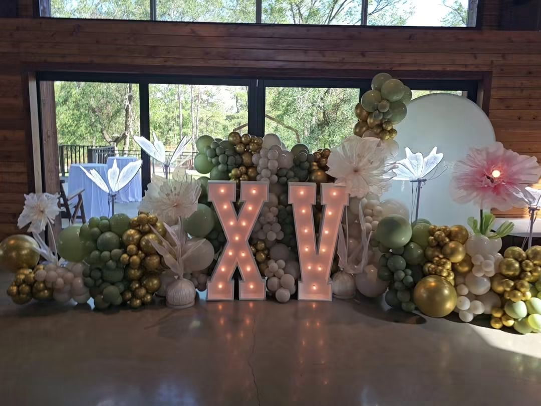 Black and gold balloon event installation